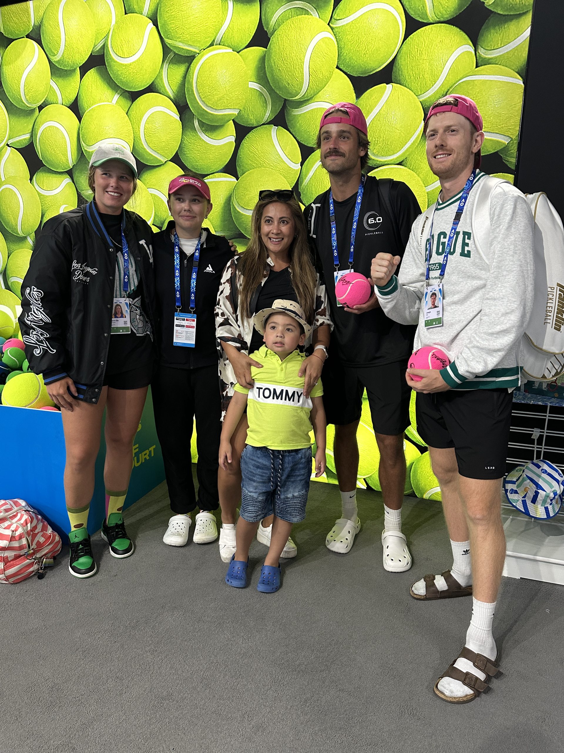 Joey Wild, Harrison Brown, Nicola Schoeman and Danni-elle Townsend stand for a photo with a young fan after winning the inaugural Australian Open Pickleball Slam in Melbourne, Australia.