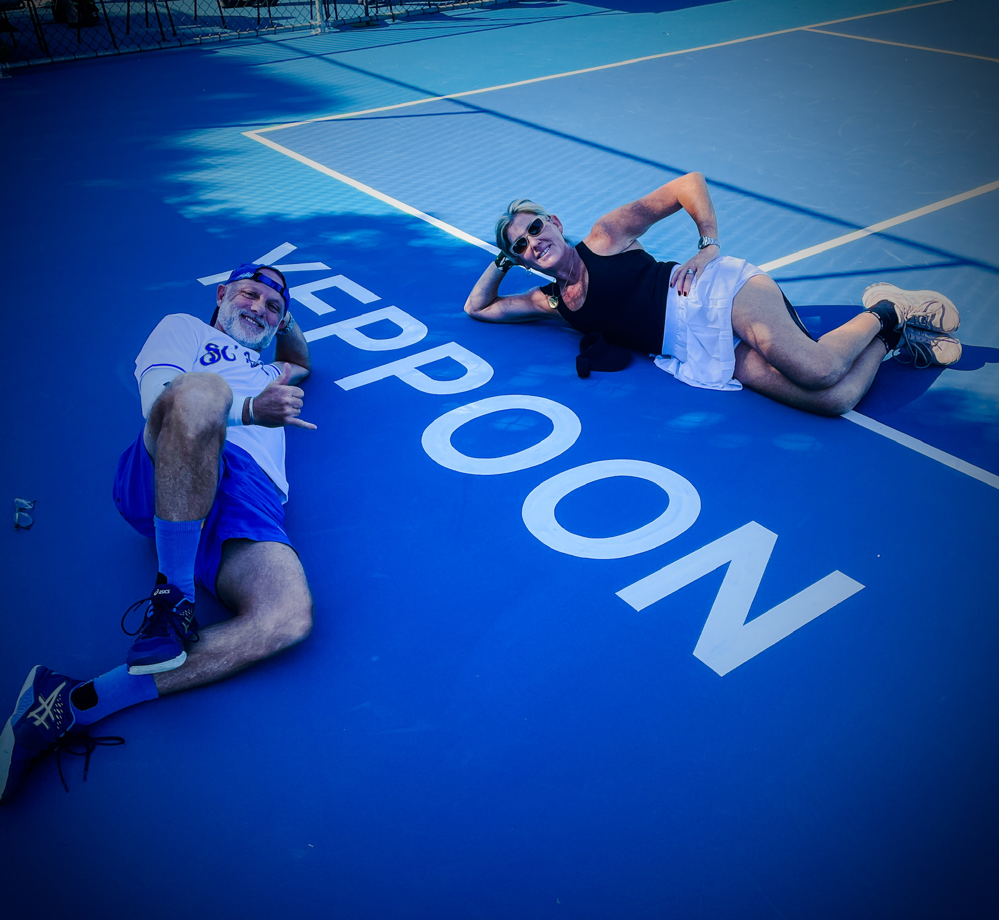 Jeanette Ward Quinn and Brad Kluss on a pickleball court