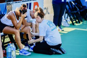 Nat Sharp treating athlete at PPA Australia tournament