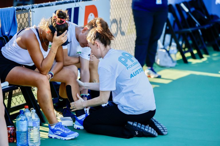 Nat Sharp treating athlete at PPA Australia tournament
